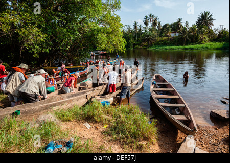 Tourists in a traditional Mokoro, dugout canoe, Okavango 