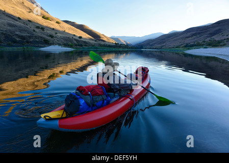 Paddling an inflatable kayak on a calm section of Idaho's Lower Salmon River. Stock Photo