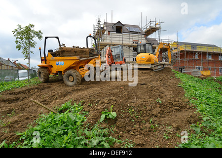 Grader parked by new housing development, Daventry, Northamptonshire, England, United Kingdom Stock Photo