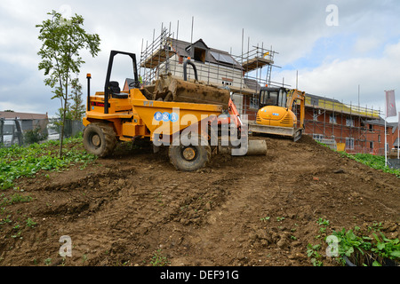 Grader parked by new housing development, Daventry, Northamptonshire, England, United Kingdom Stock Photo