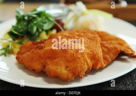 Wiener schnitzel, the popular breadcrumb coated cutlet of veal, a traditional Germanic dish, served in Munich, Bavaria, Germany Stock Photo