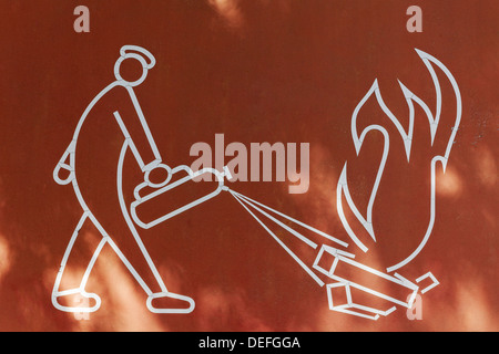 Man putting out a fire with fire extinguishers, pictogram, Innenhafen, Duisburg, Ruhr district, North Rhine-Westphalia, Germany Stock Photo