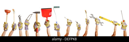 Many hands holding different tools for working and fixing things Stock Photo