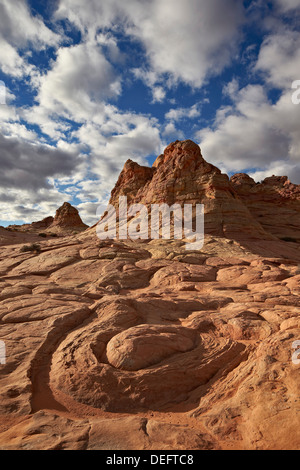 Sandstone swirl under clouds, Coyote Buttes Wilderness, Vermillion Cliffs National Monument, Arizona, United States of America Stock Photo