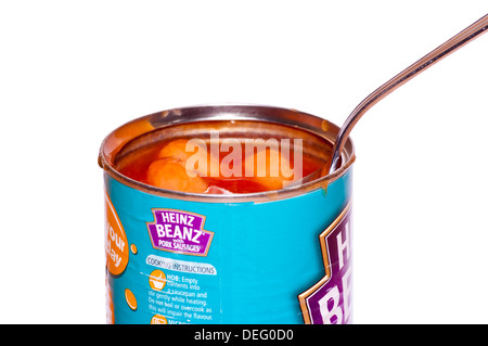 Open Tin Of baked Beans and Sausages With A Spoon In Stock Photo