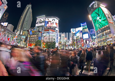 Shibuya Crossing, crowds of people crossing the intersection in the centre of Shibuya, Tokyo, Honshu, Japan, Asia Stock Photo