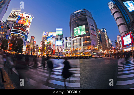 Shibuya Crossing, crowds of people crossing the intersection in the centre of Shibuya, Tokyo, Honshu, Japan, Asia Stock Photo