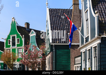 Historic windmills and houses in Zaanse Schans on the banks of the river Zaan, near Amsterdam, Zaandam, Netherlands Stock Photo