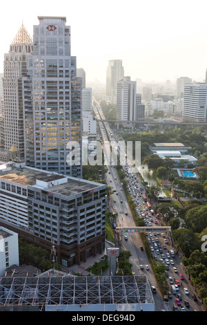 High rise buildings and traffic congestion on Rama IV in evening light, Sathorn Road, Bangkok, Thailand Stock Photo