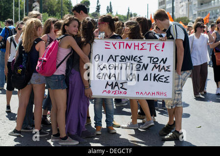 Athens, Greece, September 18th 2013. Greek public sector goes on 48 hour strike to protest against layoffs. Students hold a placard reading, 'Wake up, our teachers' agonies are ours too'. Credit:  Nikolas Georgiou / Alamy Live News Stock Photo