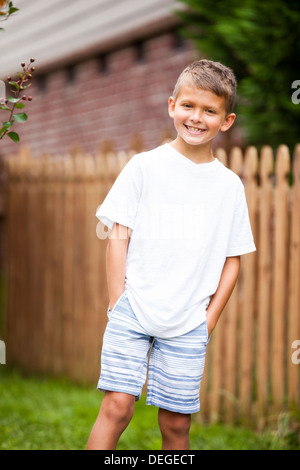 portrait of boy with hands in pockets Stock Photo