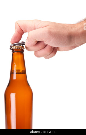 A hand opening a bottle of beer. Stock Photo