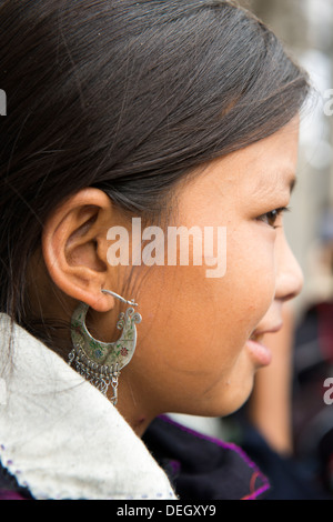 Little girl show traditional earring made by silver, Sa Pa, Vietnam Stock Photo
