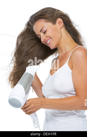 Happy young woman blow-dry Stock Photo