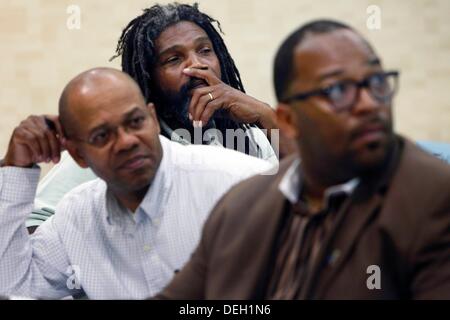 Sept. 12, 2013 - Southaven, Miss, U.S. - September 12, 2013 - Dale DeBerry (middle) listens to speakers during A Call to Action ''Saving Our Sons'' meeting of men in the Southaven Thursday evening. The event called for men from DeSoto area and surrounding counties to come together to hash out ideas for saving the area youth. The meeting was in response to the deadly shooting at a Panola High School football game which four young Horn Lake boys were arrested after a drug deal went bad. (Credit Image: © Mark Weber/The Commercial Appeal/ZUMAPRESS.com) Stock Photo