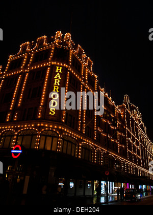 Harrods Department Store at night showing London Underground sign,  Knightsbridge, Royal Borough of Kensington and Chelsea Stock Photo