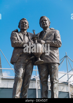 Bronze Statue of Brian Howard Clough and Peter Thomas Taylor outside the Derby County Football Stadium. Derby, Derbyshire. Stock Photo