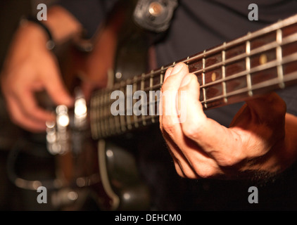 Close up electric guitar being played Stock Photo