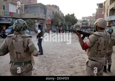 Cairo, Cairo, Egypt. 19th Sep, 2013. Egyptian soldiers guard during an operation against gunmen in the Kerdasa district in Giza, south of Cairo, Egypt, 19 September 2013. An Egyptian police general has been killed in clashes between Islamist gunmen and security forces storming a village south of Cairo, security officials said. General Nabil Farrag, assistant security director of Giza Province, died shortly after being brought to hospital. Credit:  ZUMA Press, Inc./Alamy Live News Stock Photo