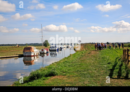 A group of country walkers on a public footpath by Upton Dyke on the Norfolk Broads, England, United Kingdom. Stock Photo