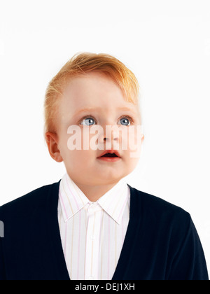 Caucasian baby dressed like an adult Stock Photo