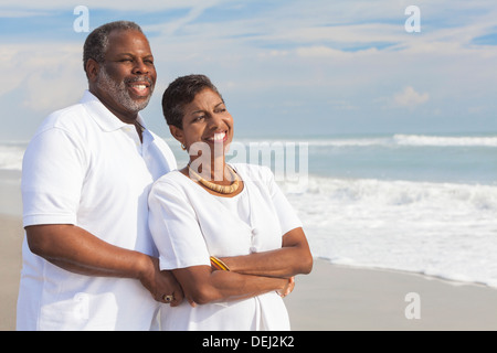 Happy romantic senior African American man and woman couple on a deserted tropical beach Stock Photo