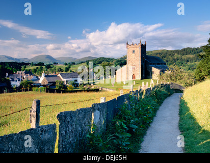 English village of Hawkshead in the Lake District National Park, Cumbria. Path leads to St Michael's parish church Stock Photo