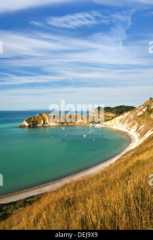 A view of Lulworth Cove, on the Jurassic Coast in Dorset UK photographed on a bright sunny day in September Stock Photo
