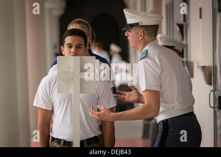 Incoming Citadel freshman known as knobs line up watched by upperclassmen during matriculation day on August 17, 2013 in Charleston, South Carolina. The Citadel is a state military college that began in 1843. Stock Photo