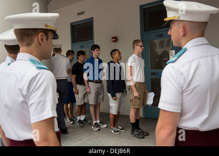 Incoming Citadel freshman known as knobs line up watched by upperclassmen during matriculation day on August 17, 2013 in Charleston, South Carolina. The Citadel is a state military college that began in 1843. Stock Photo