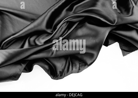 Closeup of rippled black silk fabric on plain background Stock Photo