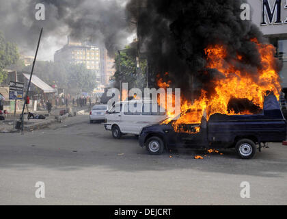 Cairo, Cairo, Egypt. 19th Sep, 2013. A burning Egyptian police car is seen in front of al-Zamalek football club's headquarters in Cairo on Sept. 19, 2013. Members of a hardcore group of fans of the Zamalek football club, the Ultra White Knights (UWK), stormed the club's headquarters in Cairo on Thursday following a protest demanding changes to the club's leadership Credit:  Ahmed Asad/APA Images/ZUMAPRESS.com/Alamy Live News Stock Photo