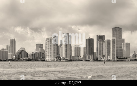 Miami skyline panorama in black and white in the day with urban skyscrapers and cloudy sky over sea Stock Photo