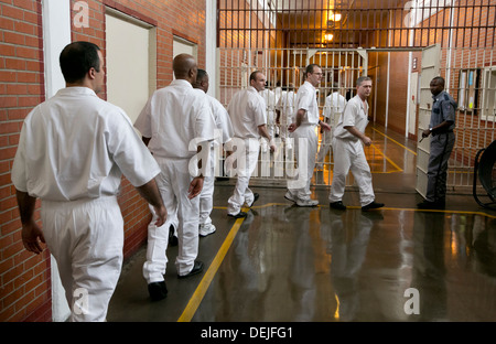 Male inmates at the Darrington Unit near Houston, Texas line up inside prison to attend event Stock Photo