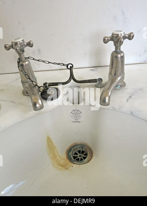 Bathroom taps and sink at Barrington Court, Ilminster, Somerset , UK TA19 0NQ Stock Photo