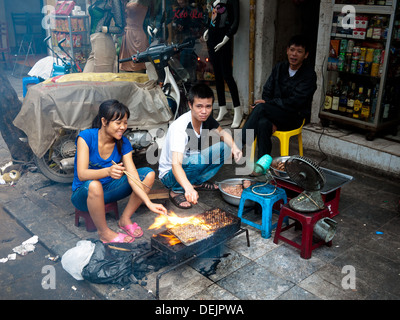 Roadside grilling and barbecue on the streets of Hanoi, Vietnam. Stock Photo