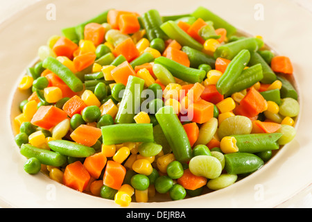 Steamed Organic Vegetable Medly with Peas, Corn, Beans, and Carrots Stock Photo