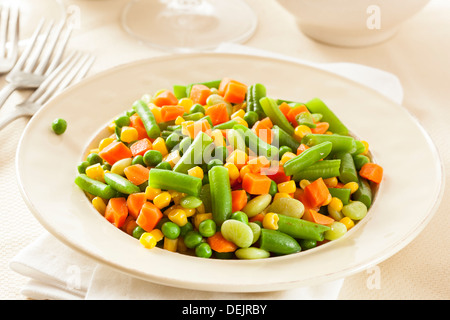 Steamed Organic Vegetable Medly with Peas, Corn, Beans, and Carrots Stock Photo