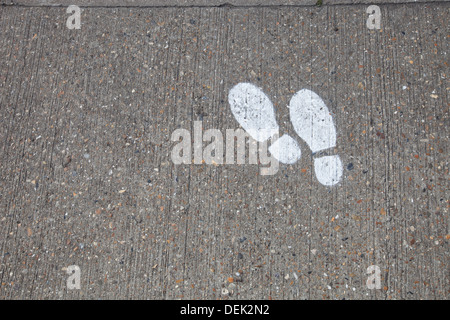 Wet footprints on the concrete floor Stock Photo