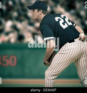 Caucasian baseball player ready to throw ball Stock Photo