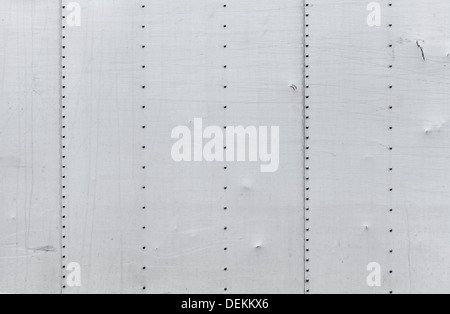 Abstract background photo texture of gray metal wall with rivets Stock Photo