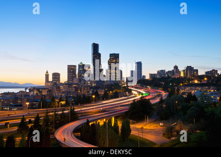 Freeways and Seattle skyline at sunset, Seattle, Washington, United States Stock Photo