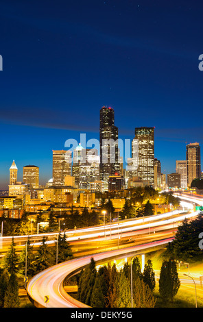 Freeways and Seattle skyline at night, Seattle, Washington, United States Stock Photo