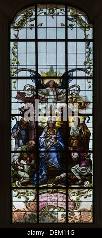 Stained glass window depicting Virgin Mary and Baby Jesus, Mother and Child, in church in Brixen im Thale  in Austrian Tyrol . Stock Photo