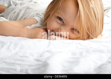 Beautiful little girl smiling after waking up Stock Photo