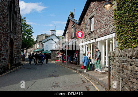 People tourists visitors walking around Grasmere village in summer Cumbria England UK United Kingdom GB Great Britain Stock Photo