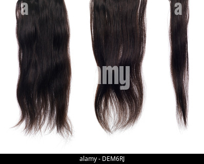 Strands, locks of dark brown hair extensions with real hair isolated texture on white background Stock Photo