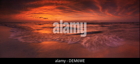 Colorful atmospheric panoramic nature scenery of red sunset over lake Huron. Ontario, Canada. Pinery Provincial Park. Stock Photo