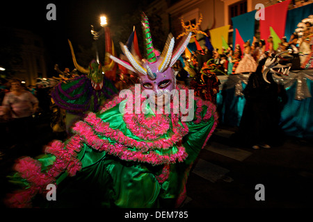 Costumed revelers called vejigantes dances in the streets during the Carnaval de Ponce February 21, 2009 in Ponce, Puerto Rico. Vejigantes are a folkloric character representing the devil. Stock Photo