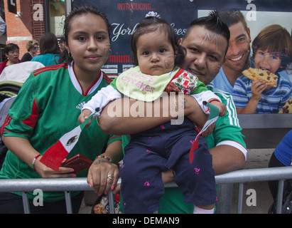 Mexican Independence Day Parade on Madison Avenue, NYC. Mexican spectators watch the parade with pride.